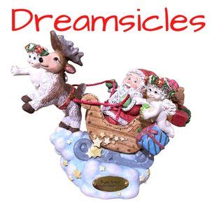 Vintage Dreamsicles Dash Away Santa Sculpture.